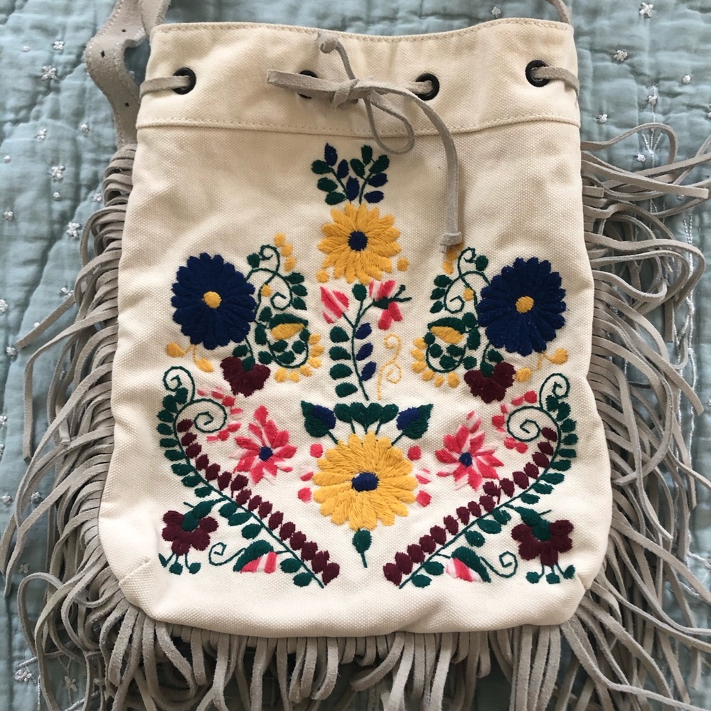 Embroidered suede fringe cross body bag